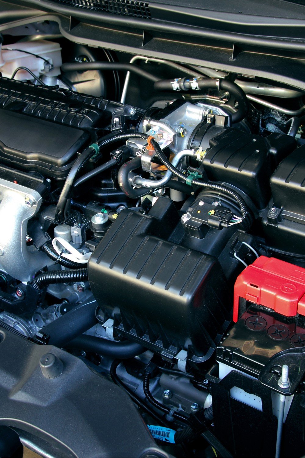 About Us - Technician performing an engine overhaul on a Kia at a Perth service center.