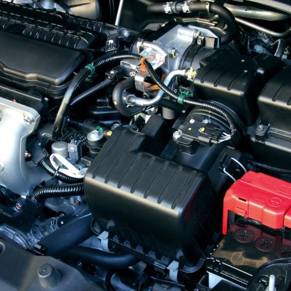 About Us - Technician performing an engine overhaul on a Kia at a Perth service center.