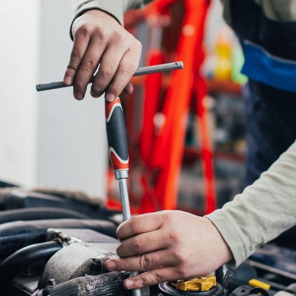 Kia vehicle being repaired by a skilled technician in Perth.